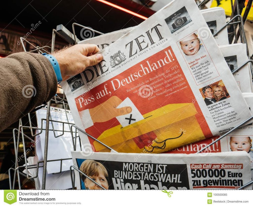 paris france sep man buying latest newspaper die zeit german press portrait angela merkel election germany 100500085 - پایگاه اطلاع رسانی آژنگ